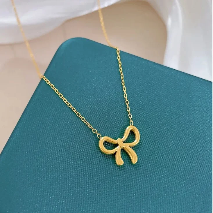 Collier pendentif femme acier inoxydable doré Noeux